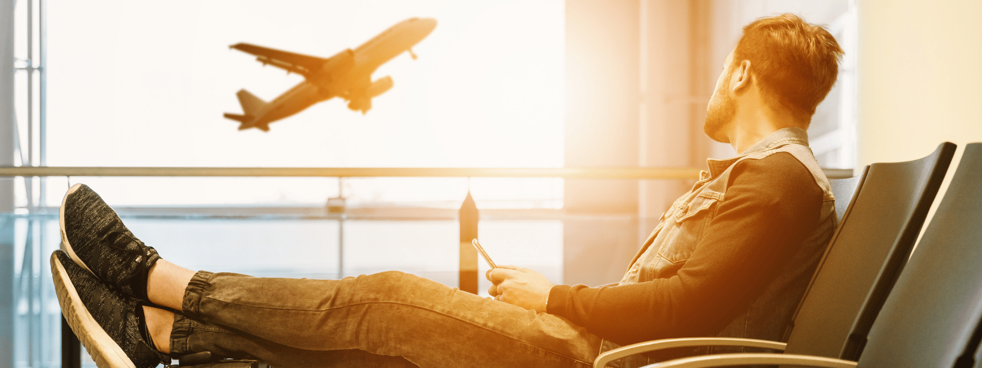 A man sits in the airport lounge watching a flight take off, pondering where in the world he can take advantage of Southpac Aerospace’s Virtual courses on offer this year.